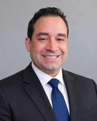 Portrait of Dr. Ian Rivera, founder of RA5olver